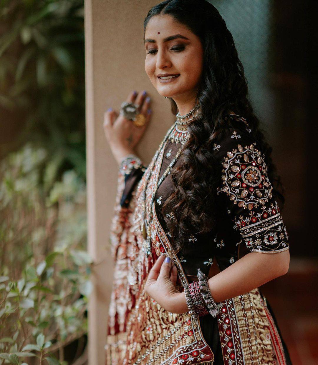 Young Woman in Burgundy Embroidered Sari and Traditional Indian Jewelry ·  Free Stock Photo